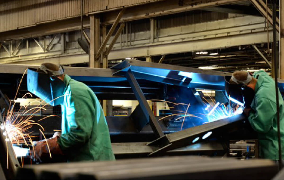 Workers welding